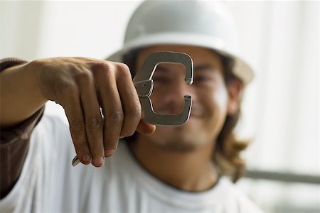 simsearch:625-01097231,k - Close-up of a male construction worker holding a work tool Stock Photo - Premium Royalty-Free, Code: 625-01745847