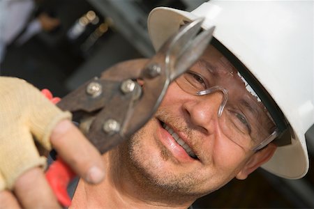 simsearch:625-01745814,k - Close-up of a male construction worker holding a cutting tool Stock Photo - Premium Royalty-Free, Code: 625-01745840