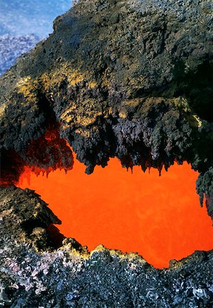 polynesian volcano - Open 'skylight' reveals river of molten lava flow, Hawaii Stock Photo - Premium Royalty-Free, Code: 625-01746074