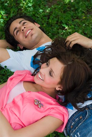 simsearch:625-01747521,k - Close-up of a young couple lying in a park Foto de stock - Sin royalties Premium, Código: 625-01746369