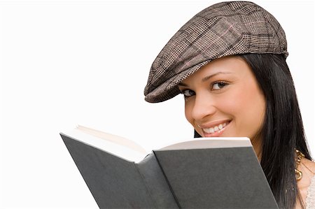 simsearch:625-01097322,k - Portrait of a young woman smiling with a book in front of her Stock Photo - Premium Royalty-Free, Code: 625-01746457