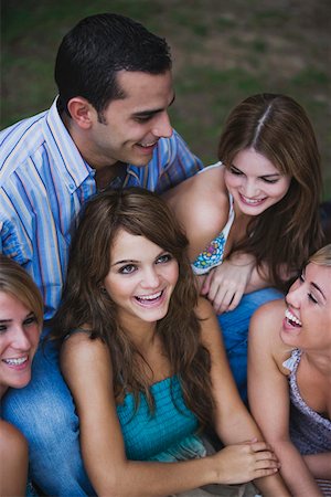 Close-up of four young women smiling with a young man Stock Photo - Premium Royalty-Free, Code: 625-01746586