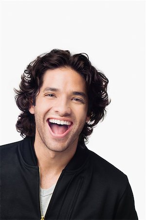 simsearch:625-01746391,k - Portrait of a young man laughing Foto de stock - Sin royalties Premium, Código: 625-01746702