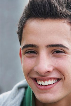 Portrait of a teenage boy smiling Stock Photo - Premium Royalty-Free, Code: 625-01746807