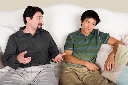 father advising son - Mid adult man talking to his son Stock Photo - Premium Royalty-Free, Code: 625-01747212