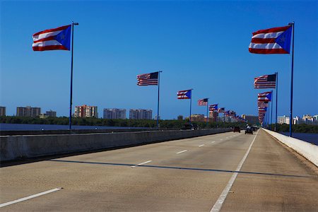 Puerto Rican and American flags on both sides of a bridge, Puerto Rico Stock Photo - Premium Royalty-Free, Code: 625-01747267