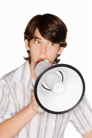 school kid cutout - Close-up of a teenage boy blowing a bullhorn Stock Photo - Premium Royalty-Free, Code: 625-01747320