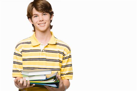 school kid cutout - Portrait of a teenage boy holding books and ring binders Stock Photo - Premium Royalty-Free, Code: 625-01747395