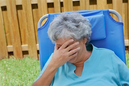 Close-up of a senior woman covering her eyes with her hand Stock Photo - Premium Royalty-Free, Code: 625-01747799