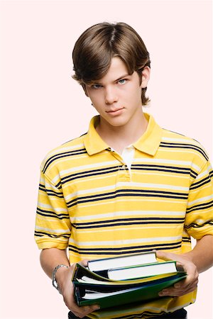 school kid cutout - Portrait of a teenage boy holding books and ring binders Stock Photo - Premium Royalty-Free, Code: 625-01747792
