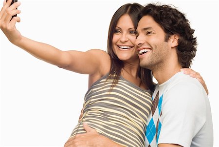 simsearch:625-01747054,k - Close-up of a young couple taking a photograph of themselves with a mobile phone Foto de stock - Sin royalties Premium, Código: 625-01747831