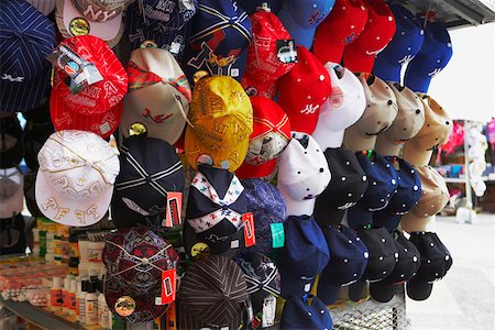 Multi-colored baseball caps at a market stall, Rio Piedras, San Juan, Puerto Rico Stock Photo - Premium Royalty-Free, Code: 625-01747910