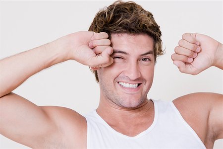 Portrait of a mid adult man stretching his arms Stock Photo - Premium Royalty-Free, Code: 625-01748126
