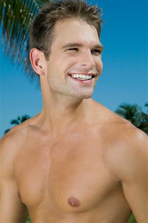 skin biceps - Close-up of a young man smiling Stock Photo - Premium Royalty-Free, Code: 625-01748144