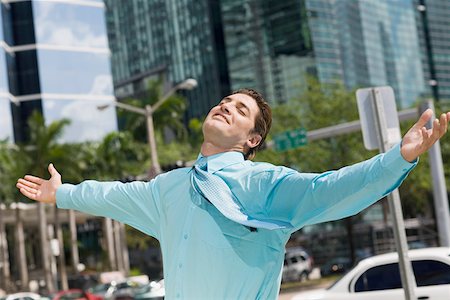 ease - Businessman standing with his arms outstretched Stock Photo - Premium Royalty-Free, Code: 625-01748363