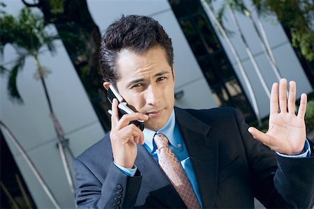 simsearch:625-02266709,k - Portrait of a businessman talking on a mobile phone Foto de stock - Sin royalties Premium, Código: 625-01748383