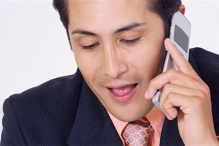 simsearch:625-02266709,k - Close-up of a businessman talking on a mobile phone Foto de stock - Sin royalties Premium, Código: 625-01748485