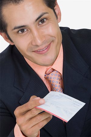 simsearch:625-01096675,k - Portrait of a businessman holding a check and smiling Stock Photo - Premium Royalty-Free, Code: 625-01748586
