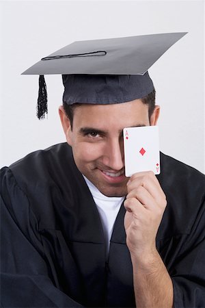 simsearch:625-01748942,k - Portrait of a mid adult man holding an ace card and smiling Foto de stock - Sin royalties Premium, Código: 625-01748937