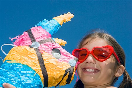 simsearch:625-01748263,k - Portrait of a girl holding a rocking horse Stock Photo - Premium Royalty-Free, Code: 625-01749008