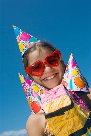 simsearch:625-01749029,k - Portrait of a girl sitting on a rocking horse and smiling Stock Photo - Premium Royalty-Free, Code: 625-01749038