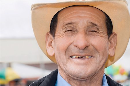 elderly latino man - Portrait of a senior man smiling Stock Photo - Premium Royalty-Free, Code: 625-01749247