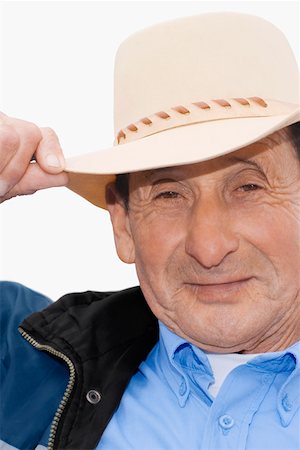 simsearch:625-02268056,k - Portrait d'un homme senior coiffé d'un chapeau et souriant Photographie de stock - Premium Libres de Droits, Code: 625-01749251