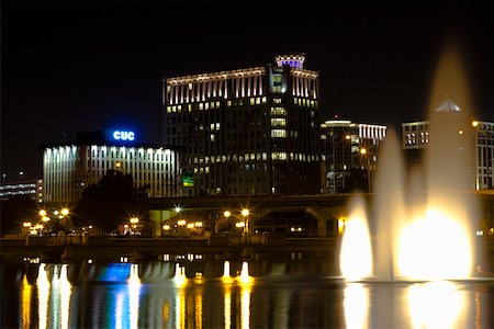 Fountains lit up at night in front of buildings, Orlando, Florida, USA Stock Photo - Premium Royalty-Free, Code: 625-01749678