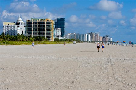 Tourists walking on the beach, South Beach, Miami Beach, Florida USA Stock Photo - Premium Royalty-Free, Code: 625-01749814