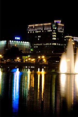 Fountains lit up at night in front of buildings, Orlando, Florida, USA Stock Photo - Premium Royalty-Free, Code: 625-01749849