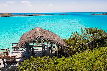 simsearch:625-01749997,k - Rear view of a man sitting on a bench, Exuma, Bahamas Foto de stock - Royalty Free Premium, Número: 625-01749997