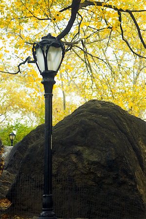 Low angle view of a lamppost near a boulder, Central Park, Manhattan, New York City, New York State, USA Stock Photo - Premium Royalty-Free, Code: 625-01750275