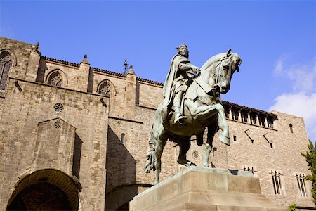 simsearch:625-01751288,k - Low angle view of a statue on a pedestal in front of a building, Barcelona, Spain Stock Photo - Premium Royalty-Free, Code: 625-01750489