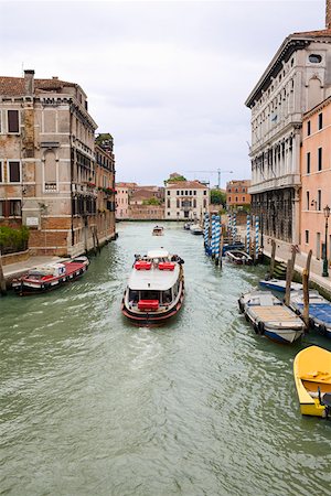 Boats and a water taxi in a canal Venice, Italy Stock Photo - Premium Royalty-Free, Code: 625-01750745