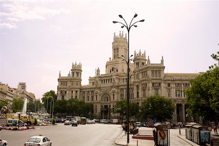 Traffic in front of a government building, Palacio De Comunicaciones, Plaza de Cibeles, Madrid, Spain Stock Photo - Premium Royalty-Free, Code: 625-01750864