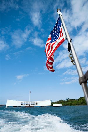 pearl harbour - American flag fluttering with a memorial building in the background, Pearl Harbor, Honolulu, Oahu, Hawaii Islands, Stock Photo - Premium Royalty-Free, Code: 625-01751084