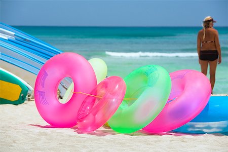 Inflatable rings and surfboards on the beach, Waikiki Beach, Honolulu, Oahu, Hawaii Islands, USA Stock Photo - Premium Royalty-Free, Code: 625-01751173