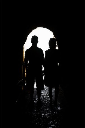 Silhouette of a man and a woman standing in an archway, Diamond Head, Waikiki Beach, Honolulu, Oahu, Hawaii Islands, USA Stock Photo - Premium Royalty-Free, Code: 625-01751188