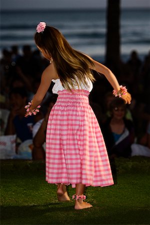 Rear view of a teenage girl hula dancing in a lawn Stock Photo - Premium Royalty-Free, Code: 625-01751256
