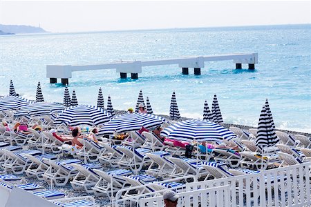 simsearch:625-02928282,k - Beach umbrellas and lounge chairs on the beach, Nice, France Stock Photo - Premium Royalty-Free, Code: 625-01751475