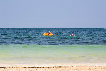 Side profile of a person boating in the sea, Cancun, Mexico Stock Photo - Premium Royalty-Free, Code: 625-01751861