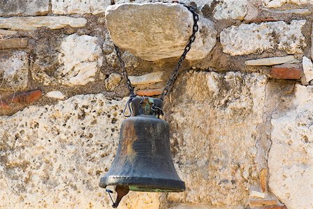 Close-up of a bell hanging on a rock, Athens, Greece Stock Photo - Premium Royalty-Free, Code: 625-01752250