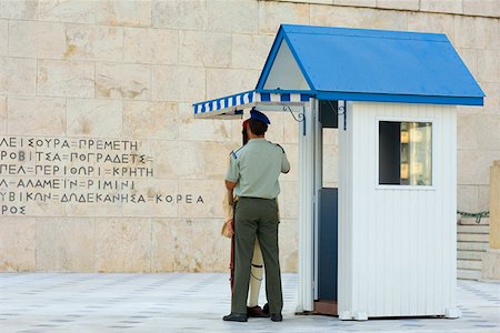 security guard uniform back view - Rear view of a security guard in front of parliament building, Athens, Greece Stock Photo - Premium Royalty-Free, Code: 625-01752285