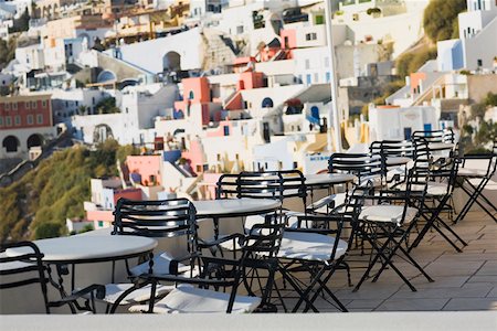 Empty chairs and tables in a restaurant, Greece Stock Photo - Premium Royalty-Free, Code: 625-01752424