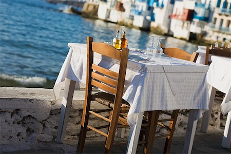 food processing greece - Table and chairs near a coast, Mykonos, Cyclades Islands, Greece Stock Photo - Premium Royalty-Free, Code: 625-01752546