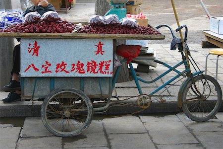 Market vendor selling plums at the roadside, Xi'an, Shaanxi Province, China Stock Photo - Premium Royalty-Free, Code: 625-01752787