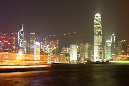 simsearch:625-01262979,k - Skyscrapers lit up at night in a city, Victoria Harbor, Hong Kong Island, Hong Kong, China Foto de stock - Sin royalties Premium, Código: 625-01752855