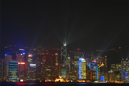 simsearch:625-01263913,k - Skyscrapers lit up at night in a city, Victoria Harbor, Hong Kong Island, Hong Kong, China Foto de stock - Sin royalties Premium, Código: 625-01752856