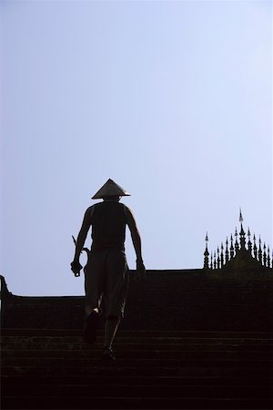 Vue arrière d'un homme à gravir les marches, Vientiane, Laos Photographie de stock - Premium Libres de Droits, Code: 625-01752875