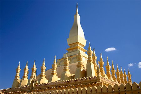 Low angle view of a temple, Buddhist temple, That Luang, Vientiane, Laos Fotografie stock - Premium Royalty-Free, Codice: 625-01752887